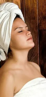 Spa themed wallpaper with woman in towel and wooden background.