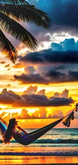 Hammock at sunset on a tropical beach with vibrant skies.