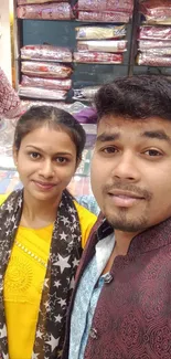 A happy couple shopping in a textile store.