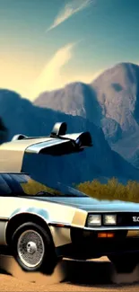 Vintage car with open gullwing doors against mountain backdrop.