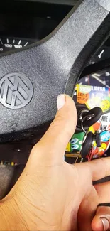 Close-up of a vintage car steering wheel and dashboard with keys.