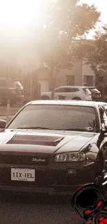 Black car in sunset with urban street backdrop.