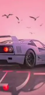 Vintage sports car against a pink sunset with birds in the sky.