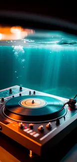 DJ turntable with ambient underwater light creating a serene, musical atmosphere.