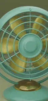 Teal vintage electric fan with golden blades.