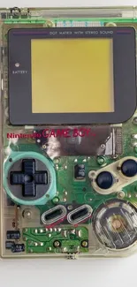 Retro Game Boy and cartridges on white background.