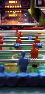 Vintage foosball table with arcade games in vibrant colors.