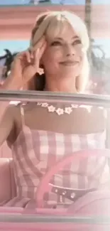 Smiling woman in pink retro car with floral accents.