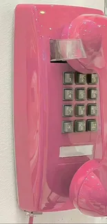 Retro pink wall-mounted phone wallpaper.