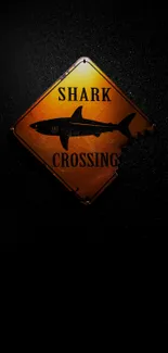 Retro shark crossing sign on dark background wallpaper.