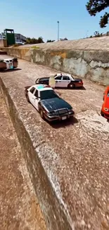 Toy cars racing on a vintage pavement in an urban setting.