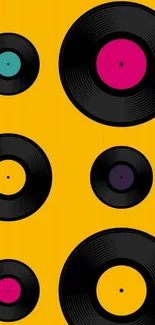 Colorful vinyl records on a yellow background.