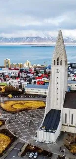 Aerial view of Reykjavik with iconic church and colorful buildings.