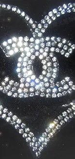 Heart-shaped rhinestone design on a black background.