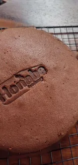 Close-up of a perfectly baked chocolate cake with stamped design.
