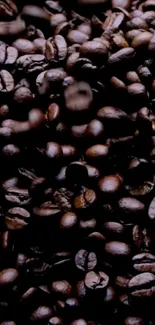 Close-up of dark brown coffee beans filling the frame with rich texture and warmth.