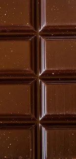 Dark chocolate bar with rich, detailed texture.