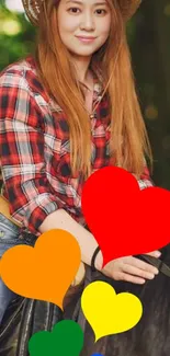 Woman in plaid shirt with colorful hearts on horseback.