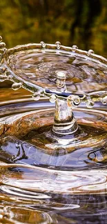 Amber water droplet with ripples on a serene background.