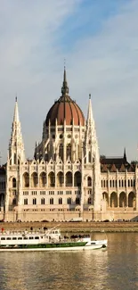 Riverside Gothic architectural building with a river in the foreground.