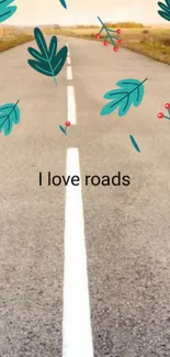 Serene road wallpaper with leaves and quote 'I love roads'.