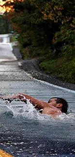 Swimmer appears on a wet road, creating a stunning optical illusion.