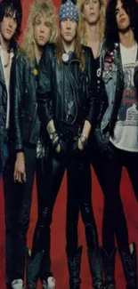 Iconic rock band in leather jackets on red background.