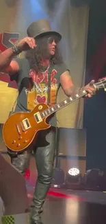 Guitarist performing live on stage at a rock concert.