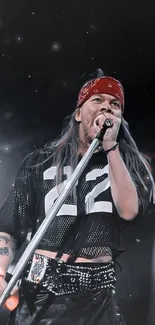 Rock singer performing live with mic on stage, vibrant energy.