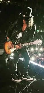 Guitarist on stage during a rock concert in the rain with a crowd.