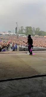 Guitarist on stage at vibrant rock concert.