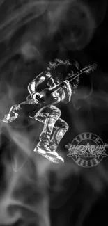 Black and white silhouette of a jumping guitarist on a dark background.