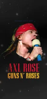 Rock star on stage with black background and red bandana.