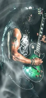 A rockstar playing guitar on stage with a dark green backdrop.