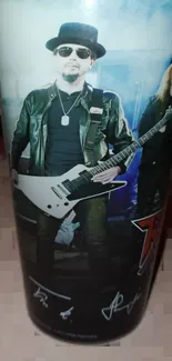 Rockstar guitarist in a black outfit with a white guitar.