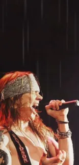 Rockstar singing passionately into a microphone with dynamic stage presence.