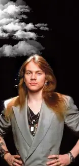 Rock star posing in a suit with long hair and tattoos on a dark backdrop.