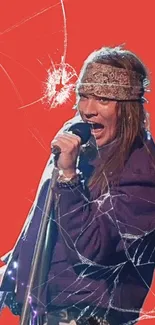 Rockstar performing with mic against a red cracked background.