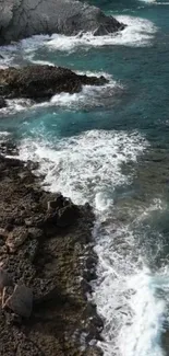 Rocky coast with waves and teal ocean water.