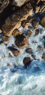 Aerial view of rocky coastline with crashing ocean waves.