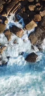 Aerial view of rocky shoreline with crashing ocean waves.