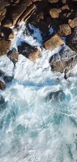 Aerial view of ocean waves hitting a rocky coastline.