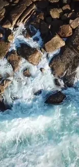 Aerial view of rocky ocean waves crashing on a shoreline.