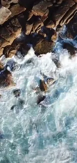 Aerial view of waves crashing against rocky cliffs.