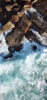 Aerial view of ocean waves crashing on rocky coast.