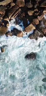 Aerial view of rocky coastline with ocean waves crashing.