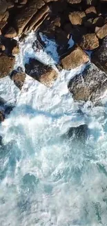 Aerial view of rocky shoreline and waves.