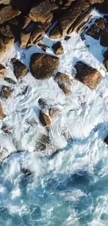 Aerial view of rocky shoreline with waves crashing against the rocks.