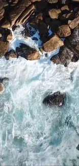 Waves crashing on rocky shoreline with vibrant ocean view.