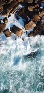 Aerial view of ocean waves hitting a rocky shoreline.